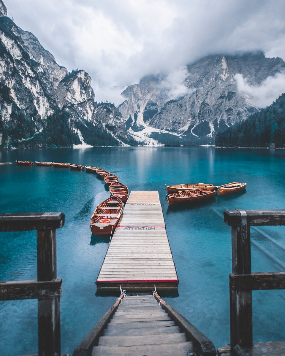 boat on body of water near mountains